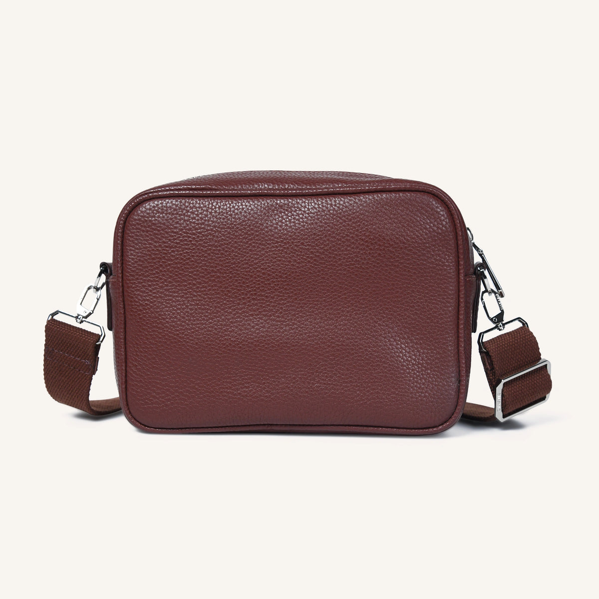 Brown leather crossbody bag on a white background