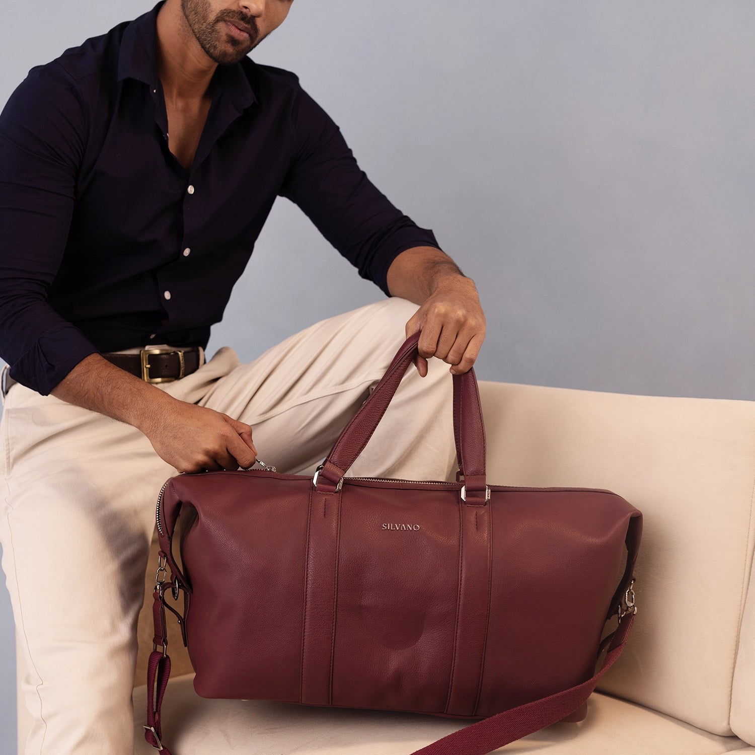 artisan hands stitching premium leather